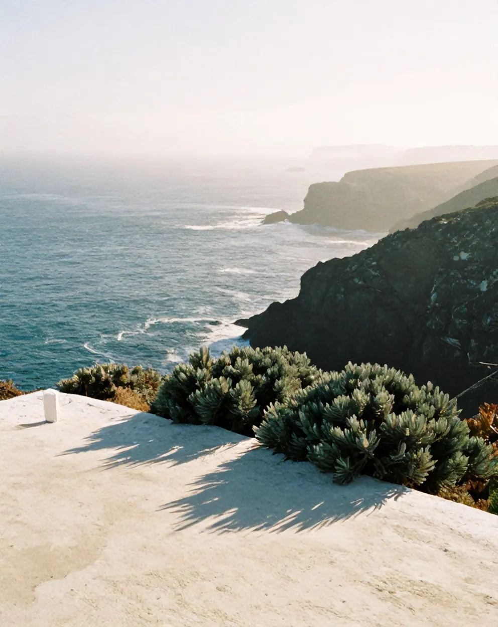 Morning haze over the sea below the cliffs
