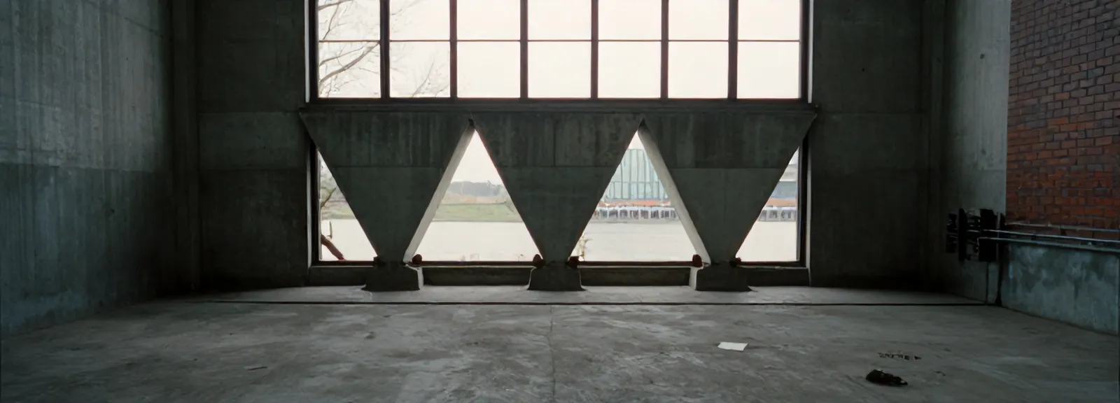 Concrete floor and grain chutes inside the silo