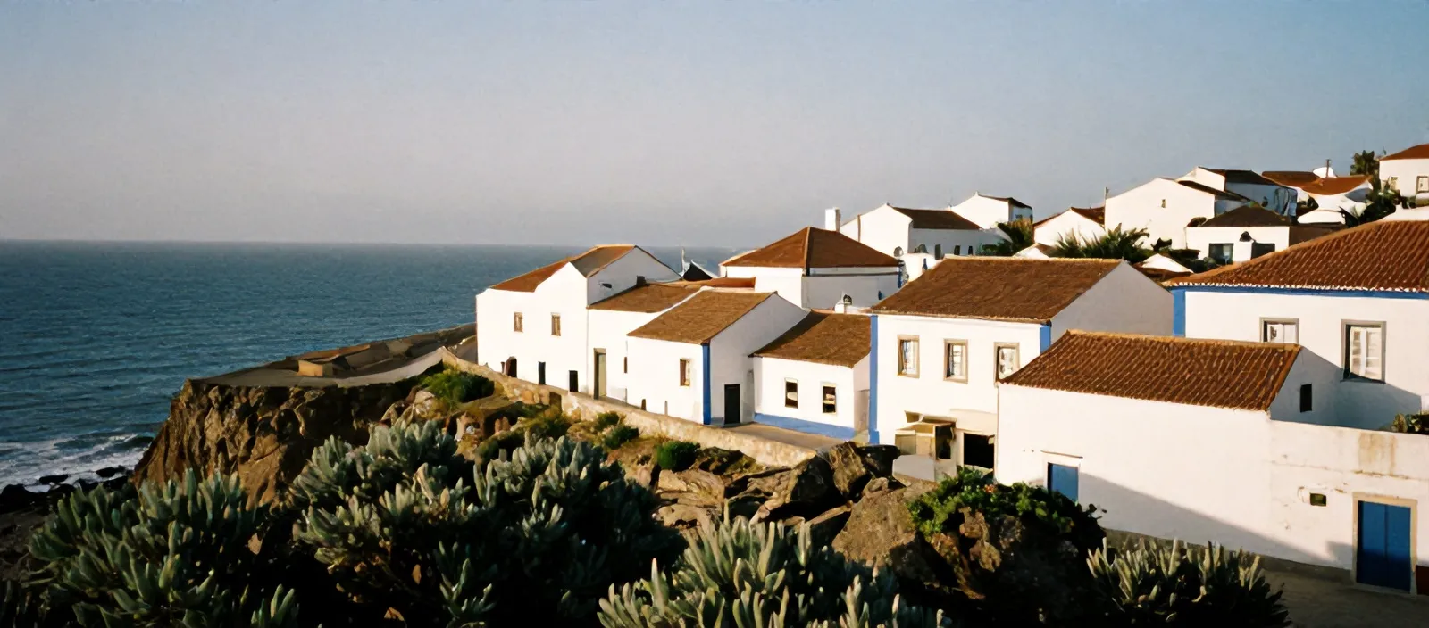 Whitewashed houses of Ericeira on the cliffs above the Atlantic