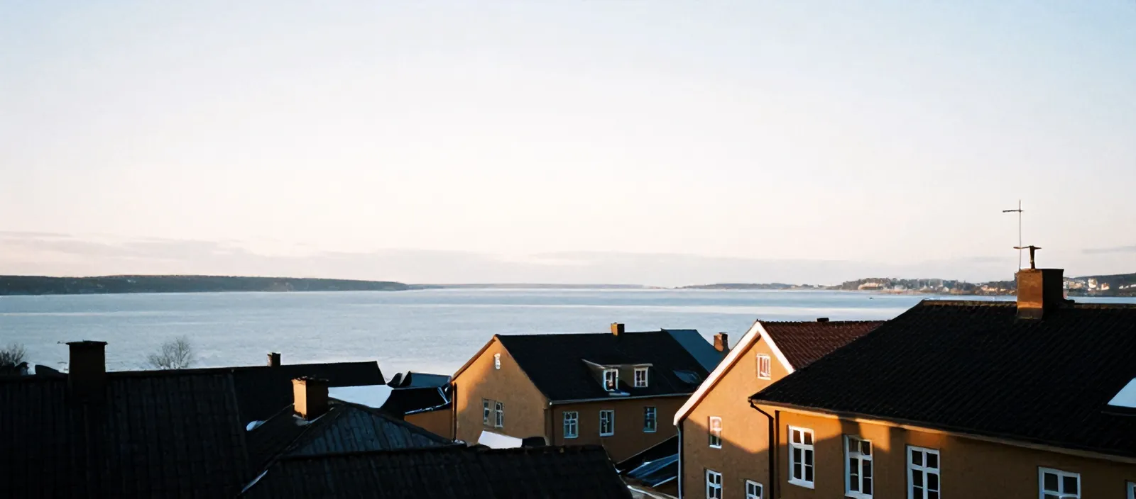 Södermalm rooftops and ochre facades above Riddarfjärden in winter light