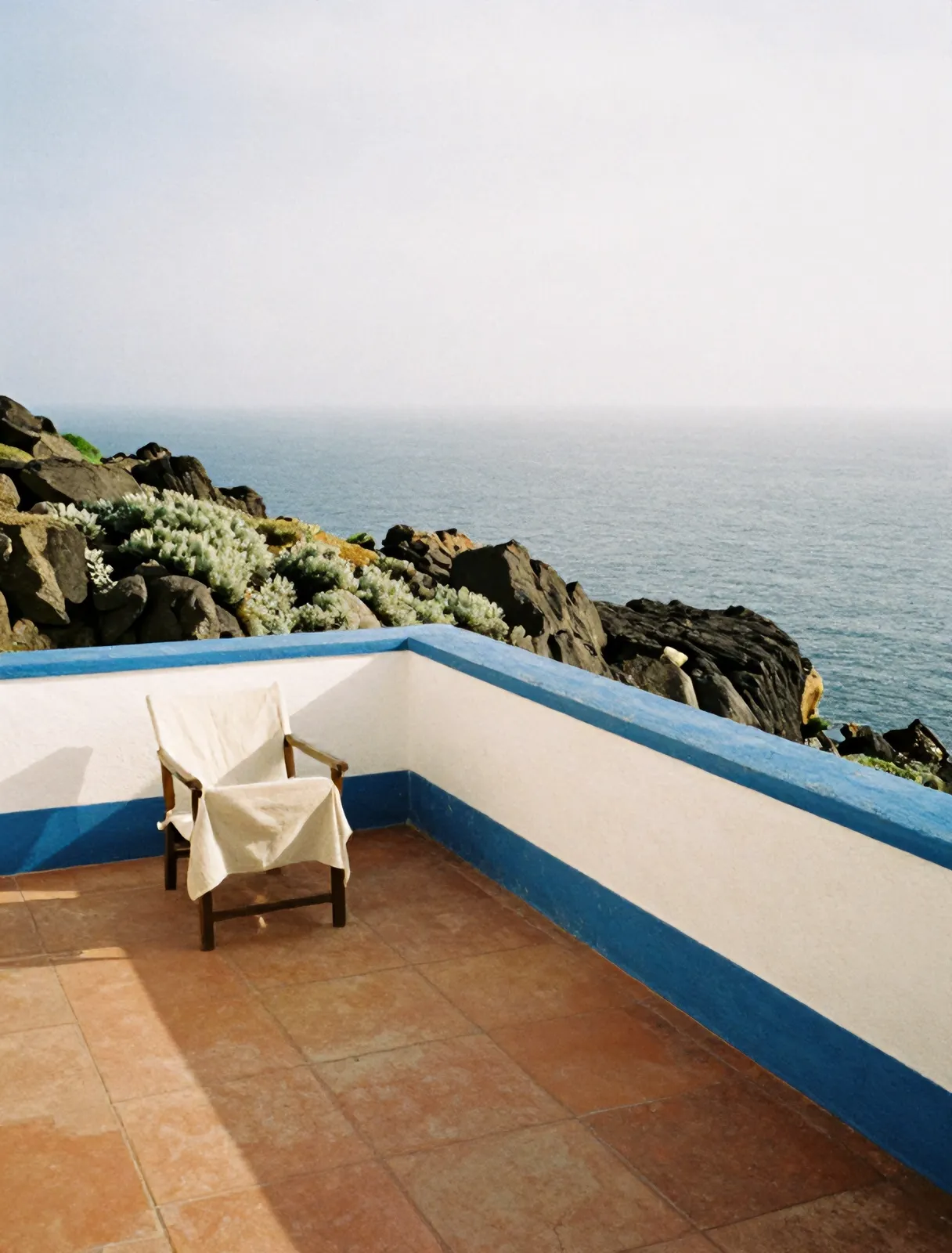 Whitewashed terrace above the sea