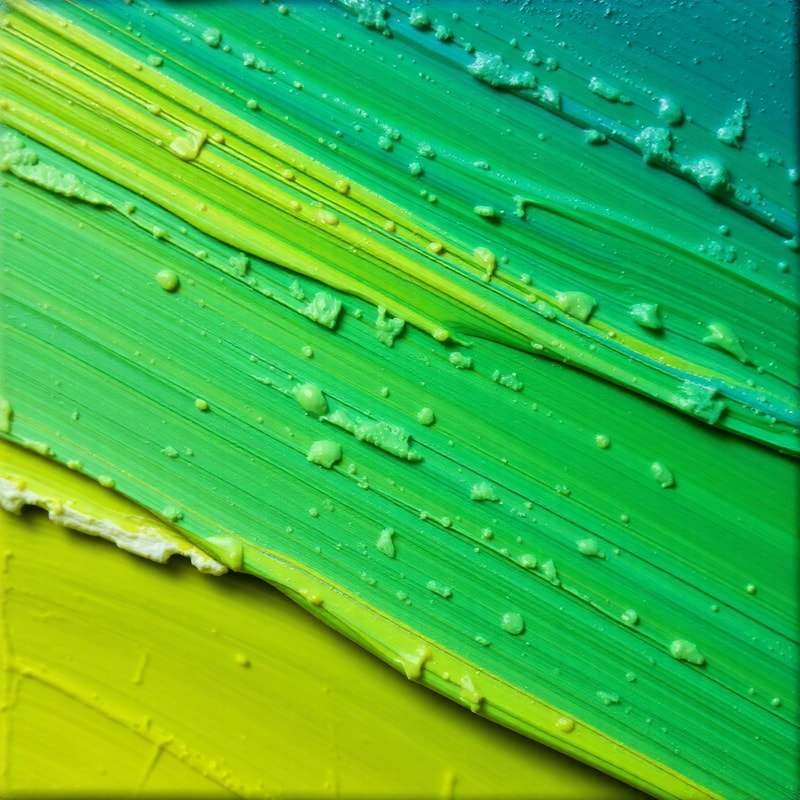 Macro of thick textured oil paint strokes in bold experimental colors